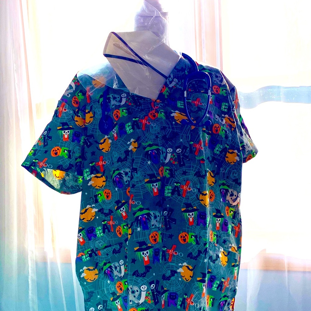 🌻 Get your Halloween ‘game on!’ Scrub Top.
